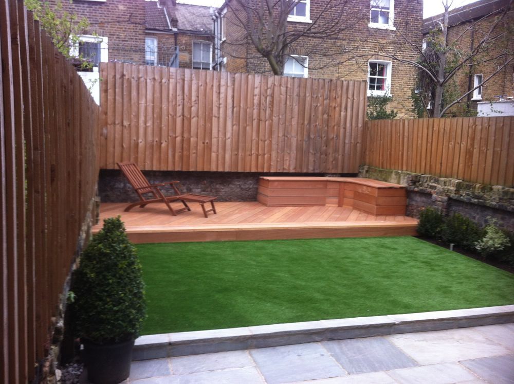 Garden with timber decking, artificial lawn and cedar fencing